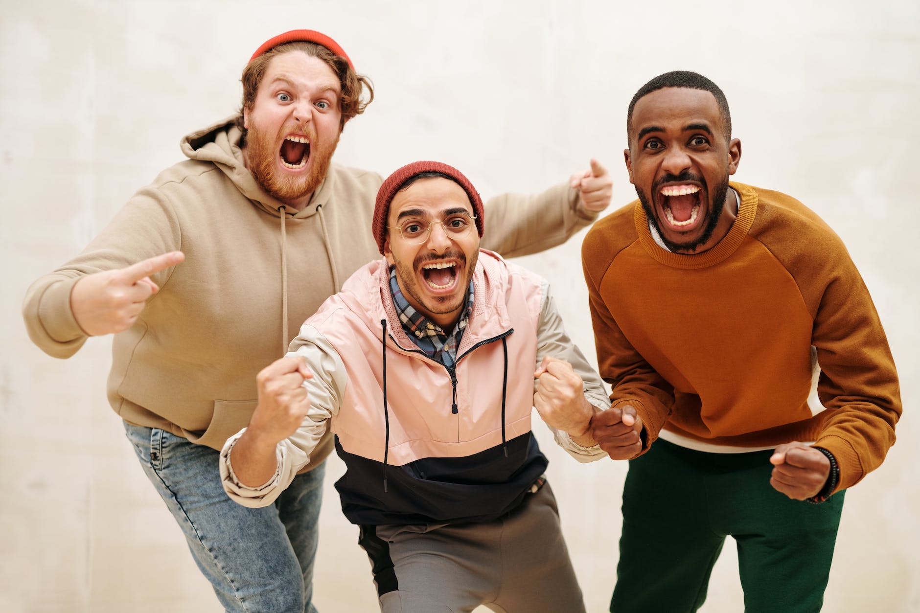 multiracial men with open mouths